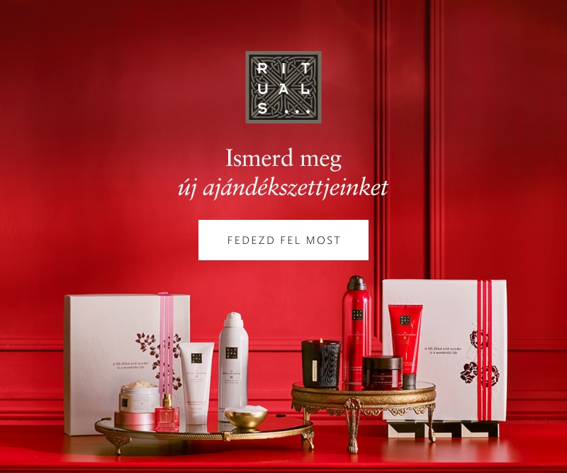 Elegáns ajándékcsomag prémium kozmetikumokkal és parfümökkel ünnepi környezetben, tökéletes karácsonyi ajándékötlet.